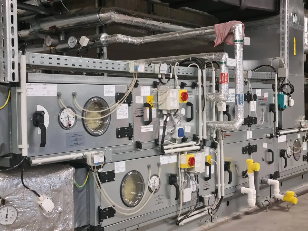 Ventilation system with heat recovery, cooling and heating coils