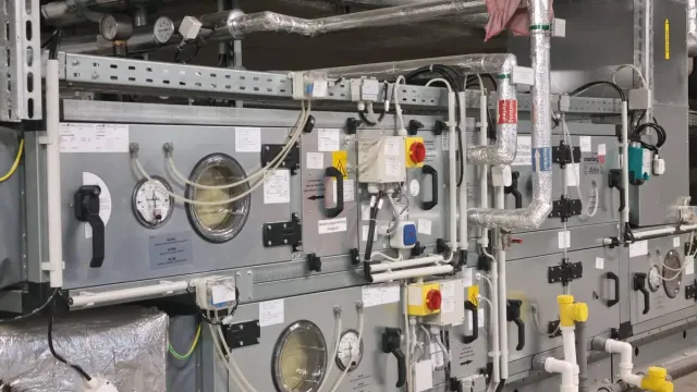 Ventilation system with heat recovery, cooling and heating coils